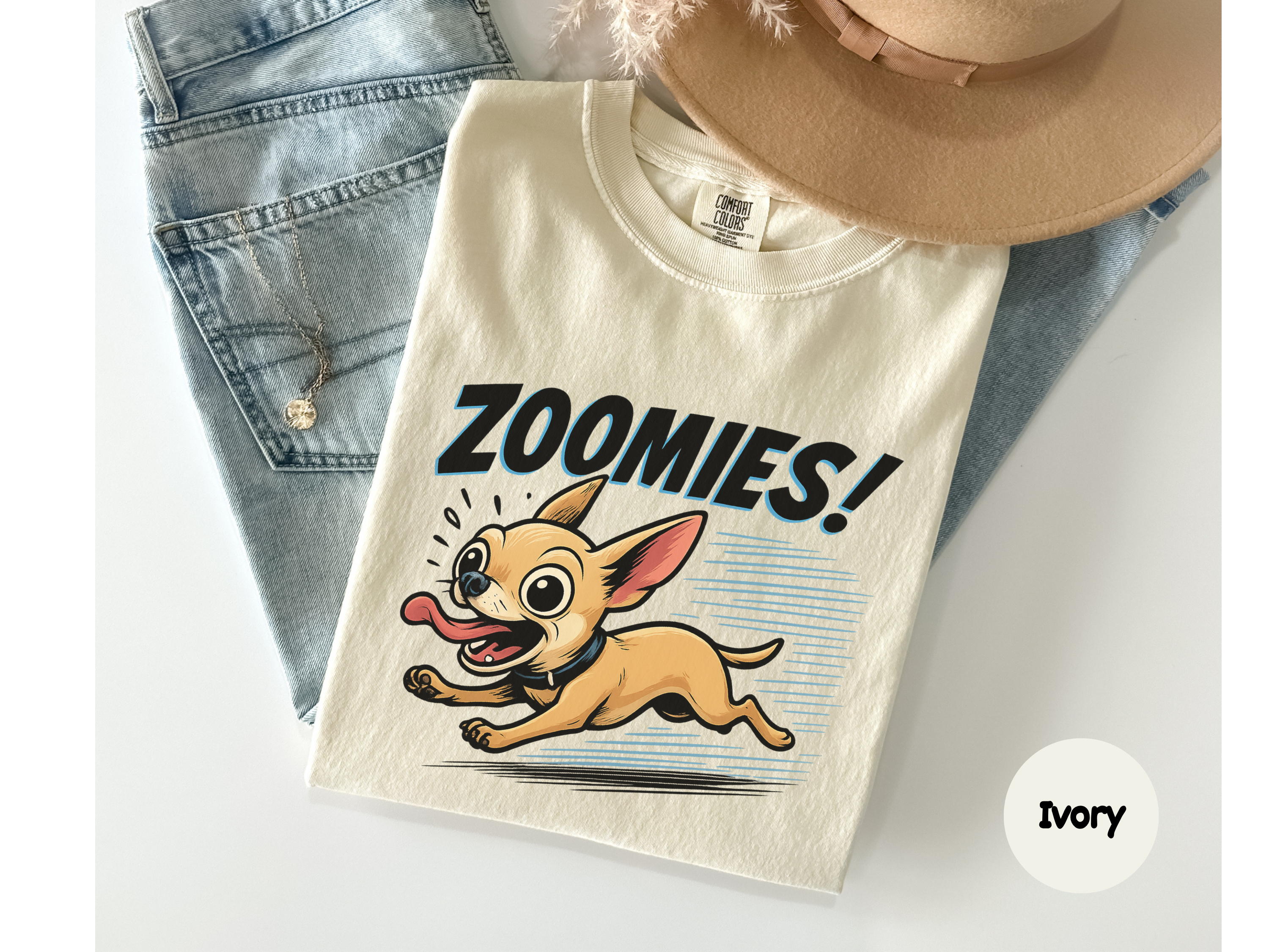 Beige t-shirt with chihuahua cartoon dog and 'Zoomies!' text on a white background