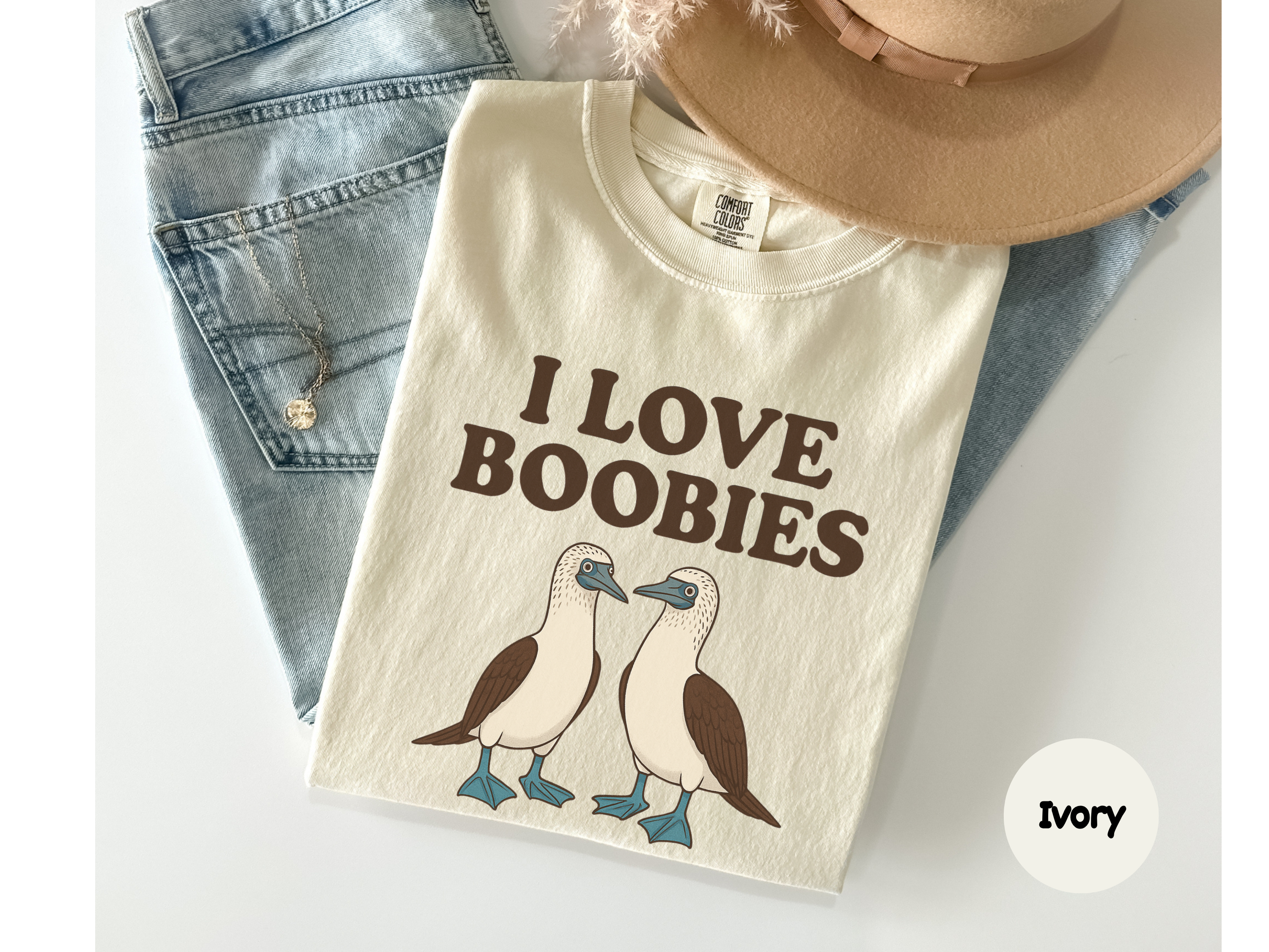 Bird pun t-shirt “Boobies” design showing two seabirds printed on relaxed unisex shirt perfect for casual style.