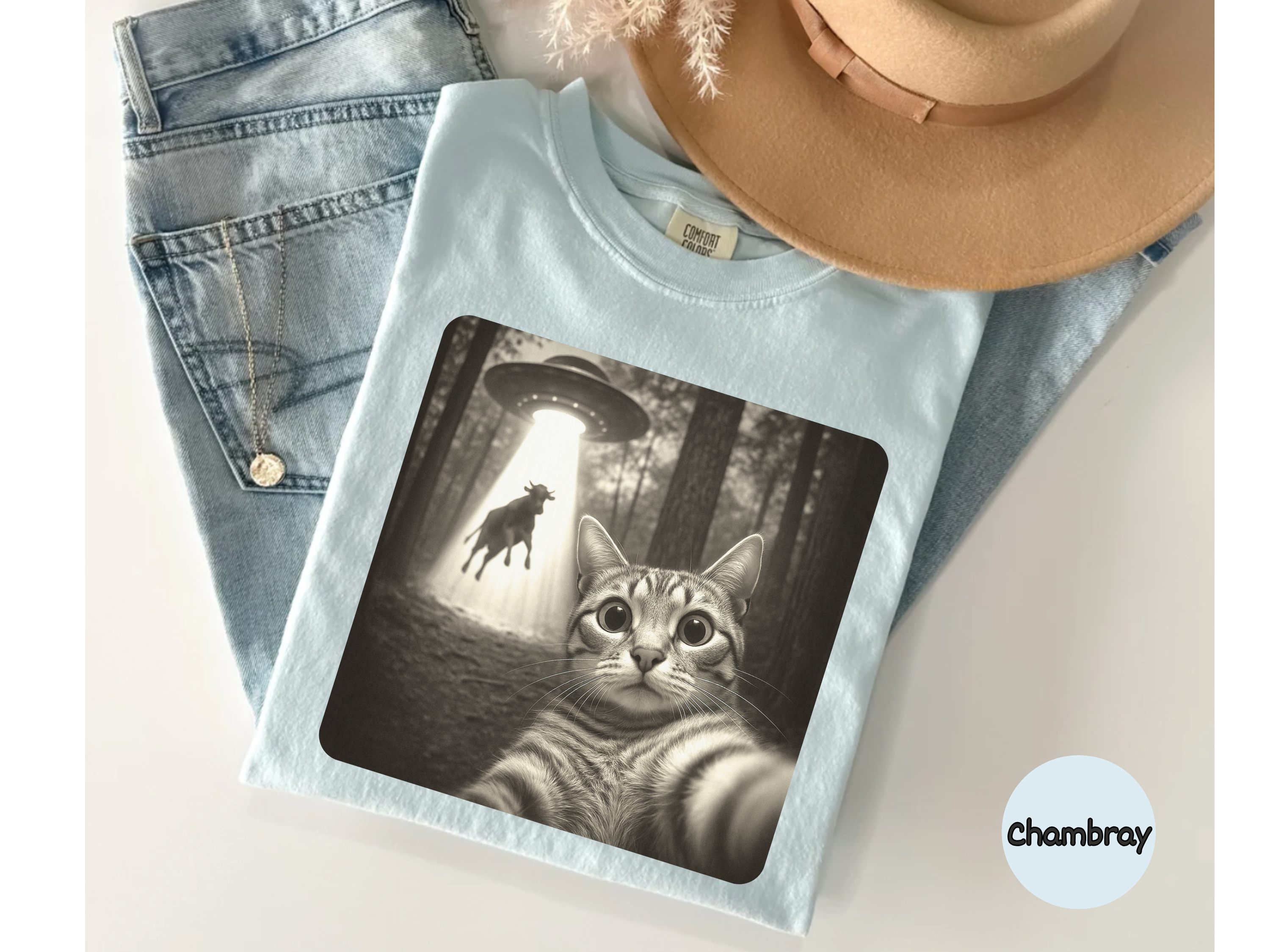 Soft tee with cat under UFO design on t-shirt for sci-fi pet lover gifts and playful casual outfit.
