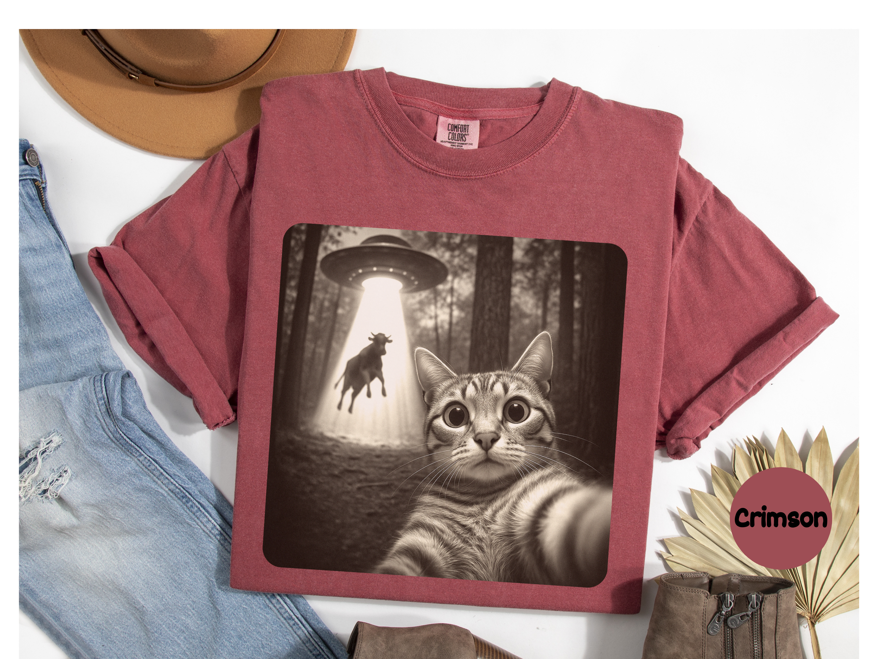 Graphic t-shirt featuring cat selfie under UFO beam perfect for cat lover gift, science-fiction style, and fun casual wear.