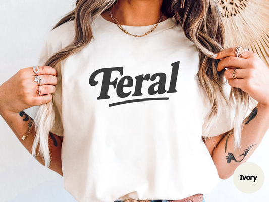 Feral graphic tee with clean typography showcasing a one word joke perfect for people who love dry humor attitude shirts and simple funny designs