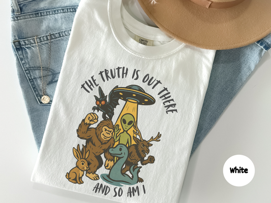 Sci fi humor t shirt combining Bigfoot, Loch Ness monster, mothman, and extraterrestrial artwork