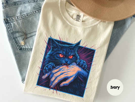 Cat biting hand graphic tee featuring intense black cat illustration for edgy cat lovers