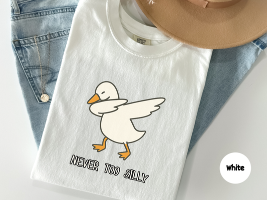 Funny t shirt featuring a cartoon goose doing a dab with the words Never Too Silly on a black background perfect for animal lovers meme fans and anyone who enjoys playful dance humor