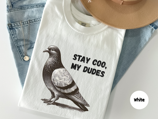 Funny t shirt featuring a detailed vintage style pigeon illustration with the phrase Stay Coo My Dudes on a black background perfect for meme lovers bird fans and fans of subtle humor