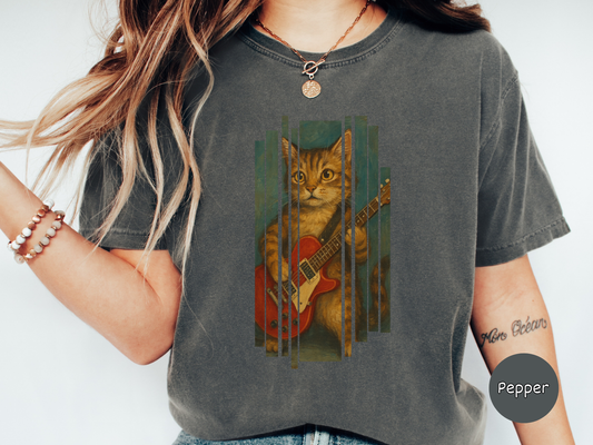 Funny cat guitar t shirt featuring an artistic painting style illustration of a cat holding and playing a red electric guitar in a vertical panel layout
