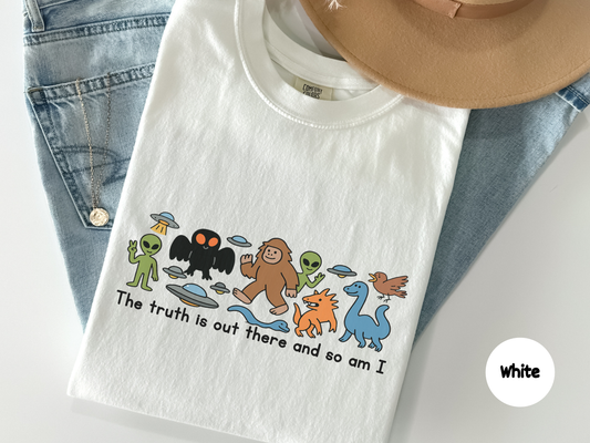 the truth is out there and so am i shirt showing playful cryptid characters including alien bigfoot mothman and loch ness style creature