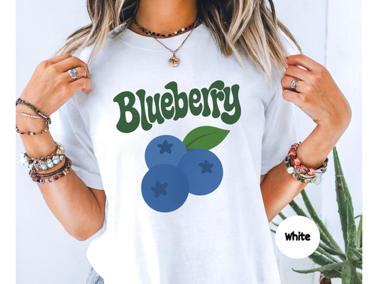 Blueberry fruit graphic t shirt featuring three blue blueberries with small star details and retro blueberry lettering on black background
