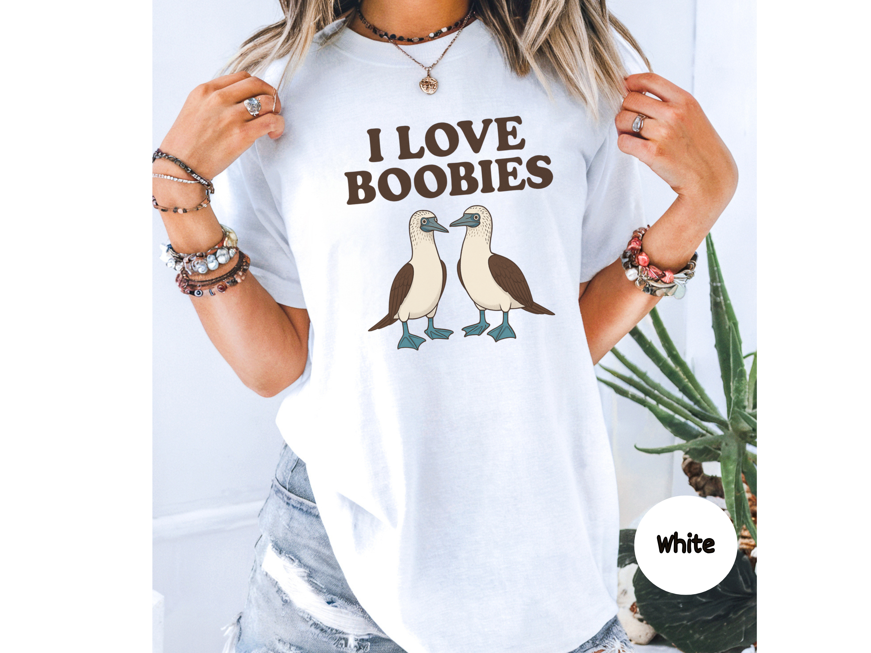 “Boobies” meme t-shirt featuring two cartoon seabirds pun design perfect for novelty gifts and funny casual wear.