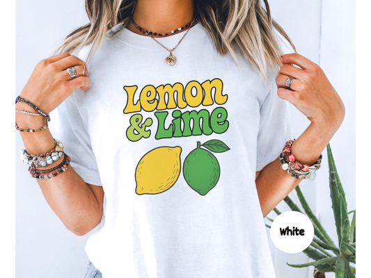 Lemon and lime fruit graphic t shirt featuring yellow lemon and green lime illustrations with bold retro lemon and lime text on black background