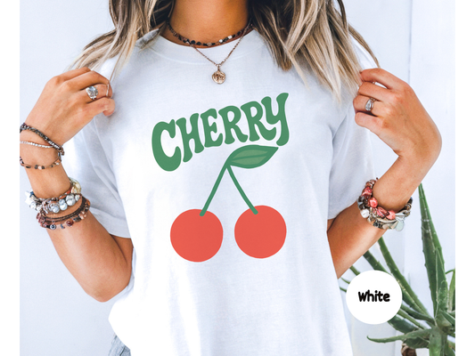 Minimalist cherry fruit graphic t shirt featuring two bright red cherries with green stems and leaf, bold retro cherry lettering on black background