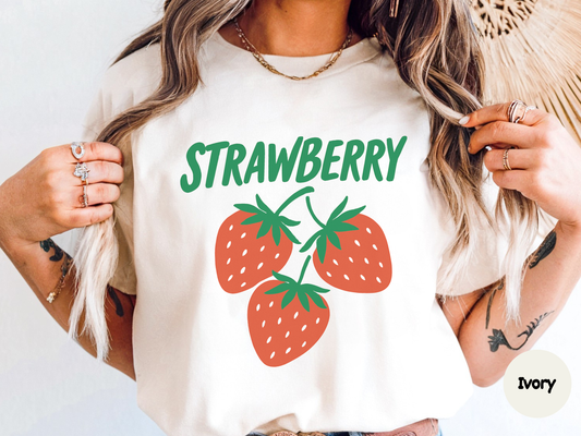 strawberry text t shirt design with bold green lettering spelling strawberry and illustrated red strawberries